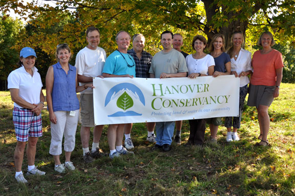 Hanover Conservancy board and staff holding banner