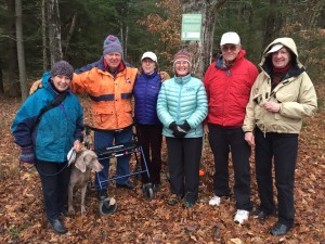 Kay and Peter Shumway, Nancy Collier, Adair Mulligan, and Elisha and Anne Huggins stand by the new trailhead sign.