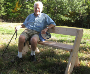 Board Member Emeritus member Jim Hornig sits on a bench in 2011