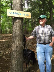 Rob Chapman by trail sign